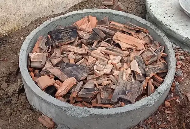 filling soak pit with brick bat